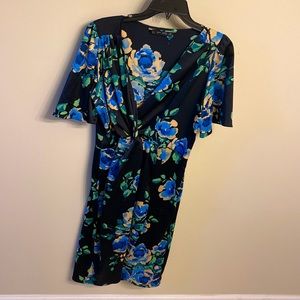 Multi color mini dress with ruched waist.